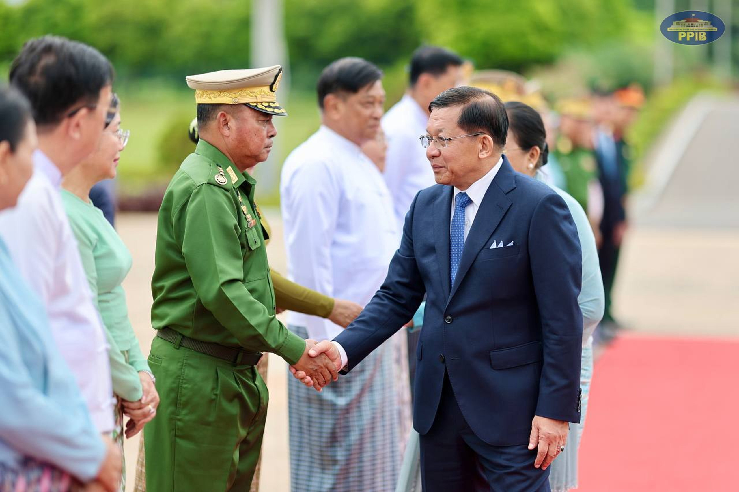 In this photo released by Myanmar President Office, Myanmar President Min Aung Hlaing, right, shakes hands with Commander-in-Chief Gen. Ye Win Oo, left, upon his departure to Vietnam, at the Naypyitaw international airport Friday, Sept. 4, 2026, in Naypyitaw, Myanmar.